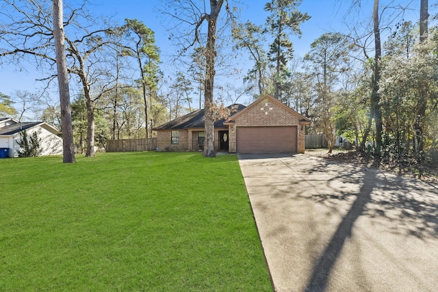 single story home with a front yard and a garage