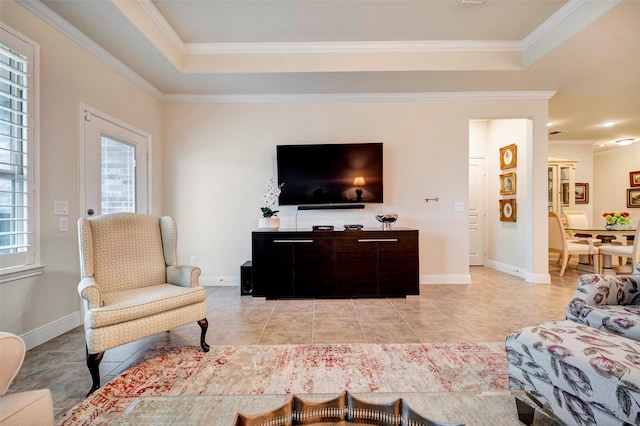 tiled living room featuring a tray ceiling, a wealth of natural light, and crown molding