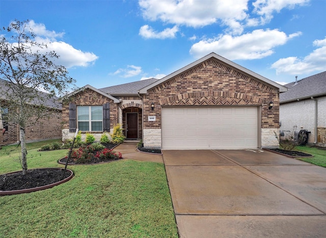 ranch-style house featuring a front lawn and a garage