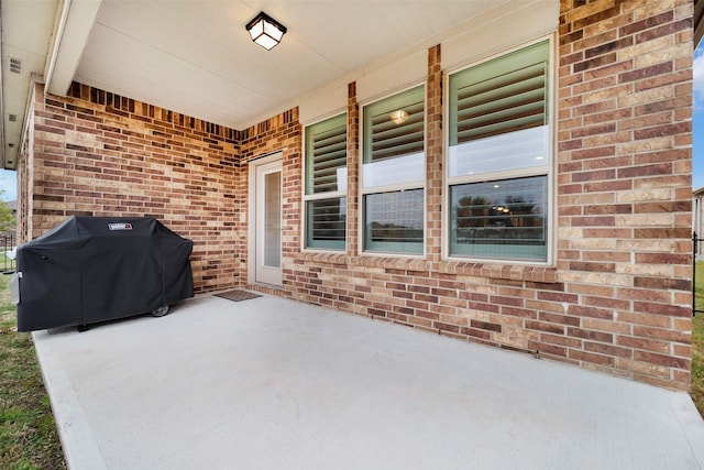 view of patio featuring a grill