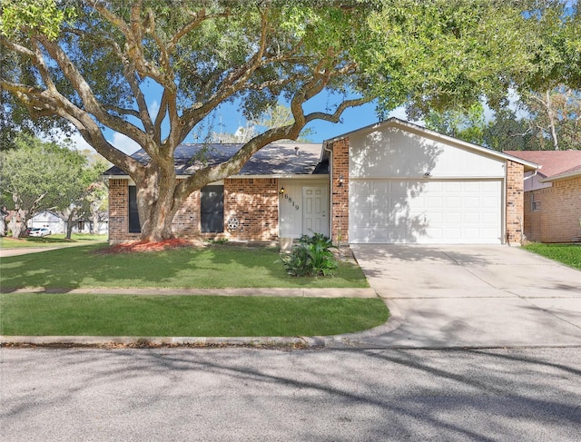 ranch-style house featuring a garage and a front lawn