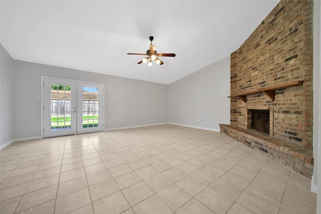 unfurnished living room with a fireplace, french doors, light tile patterned floors, and ceiling fan