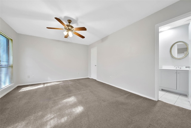 unfurnished room with light colored carpet and ceiling fan