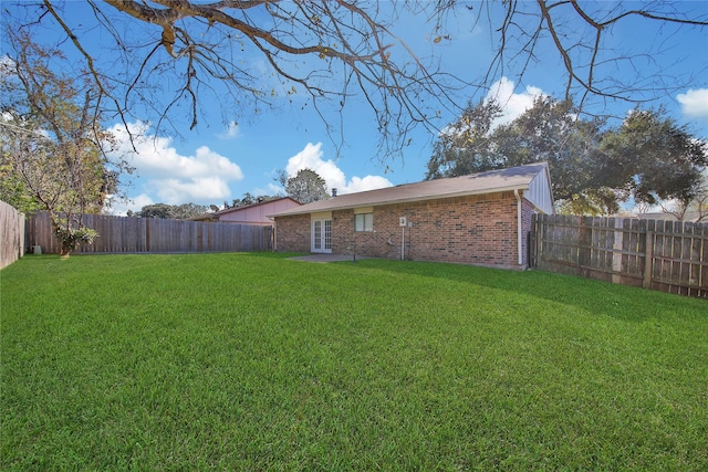 view of yard with french doors