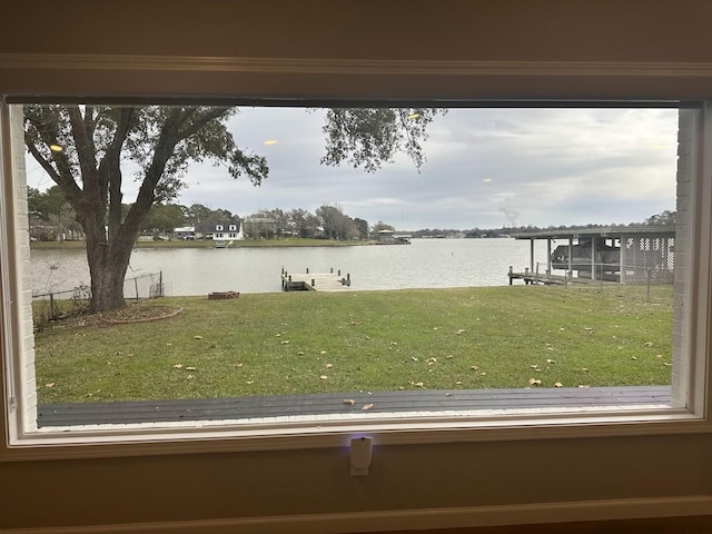 view of dock featuring a yard and a water view