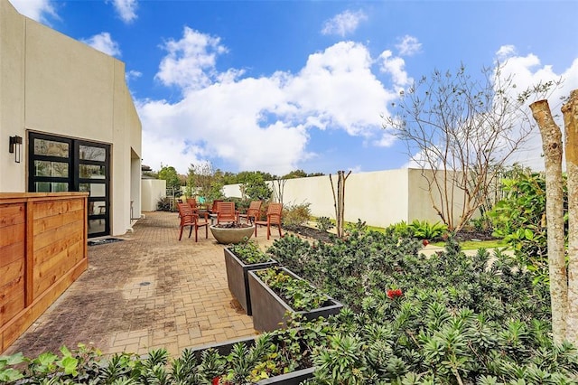 view of yard with fence and a patio