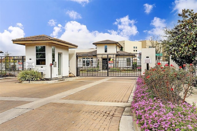 view of gate featuring fence