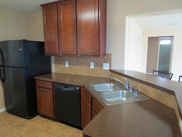 kitchen with black appliances, sink, light tile patterned floors, tasteful backsplash, and kitchen peninsula