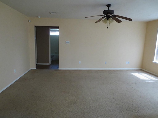 empty room with carpet flooring and ceiling fan