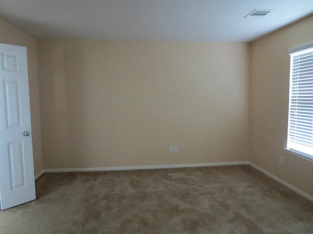 view of carpeted spare room