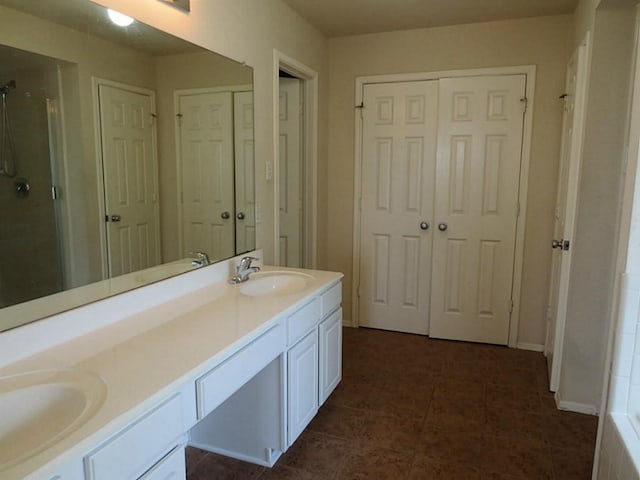 bathroom with vanity, tile patterned floors, and walk in shower