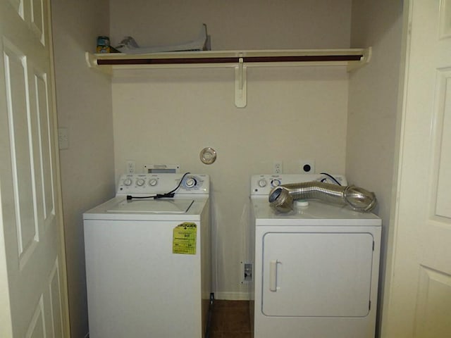 clothes washing area featuring washer and dryer