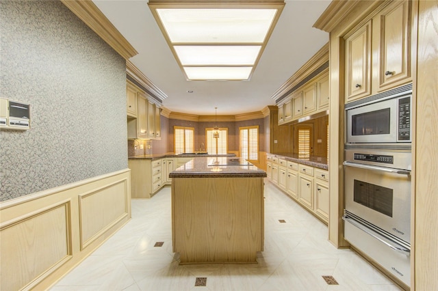 kitchen featuring pendant lighting, light brown cabinets, ornamental molding, a kitchen island, and stainless steel appliances