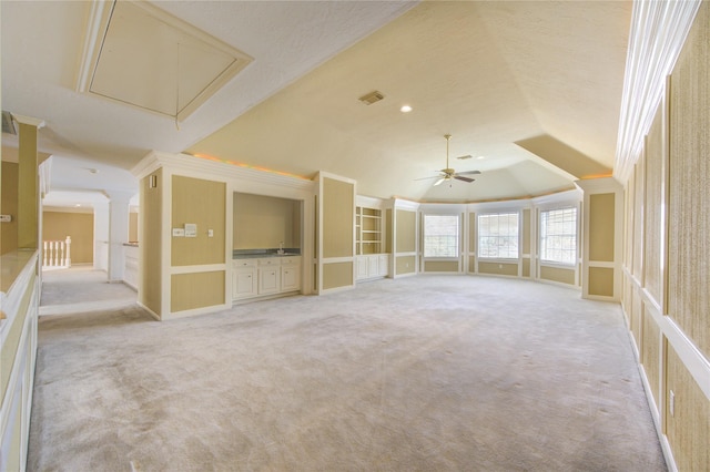 unfurnished room featuring ceiling fan, light colored carpet, a textured ceiling, and vaulted ceiling