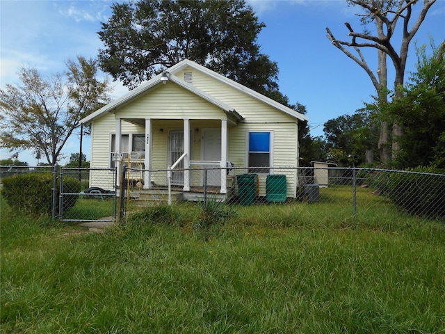 bungalow-style home featuring a front yard