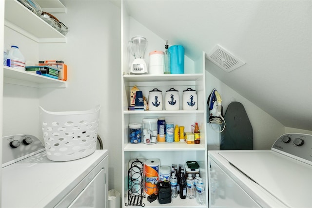 laundry room featuring washing machine and clothes dryer