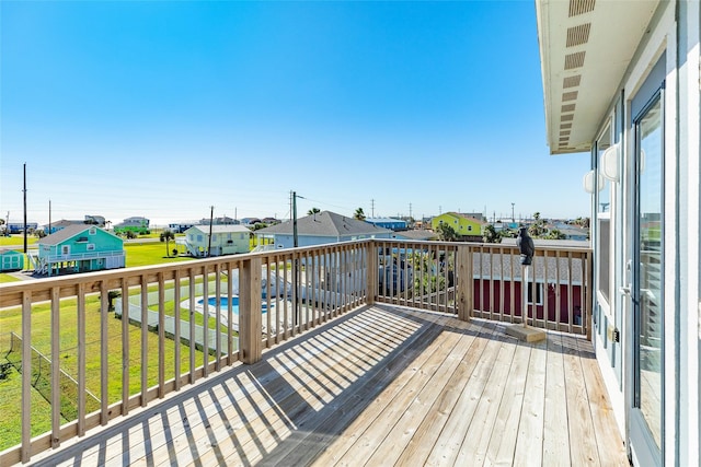 wooden deck featuring a yard