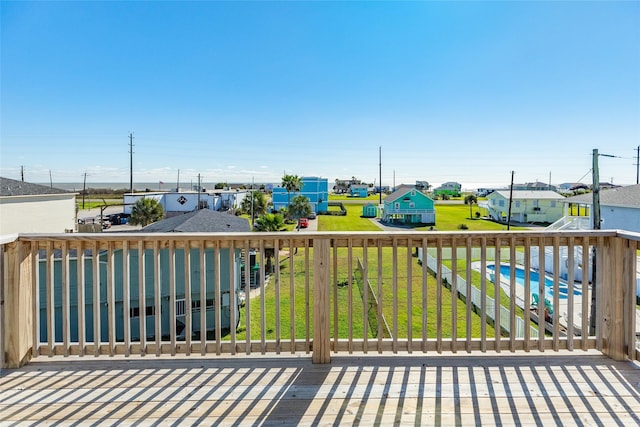 wooden deck with a yard