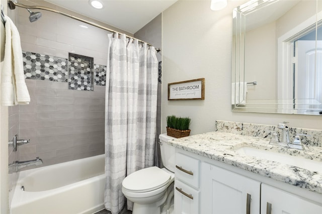 full bathroom with vanity, shower / bath combination with curtain, and toilet