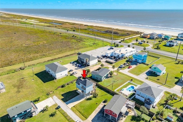 aerial view featuring a view of the beach and a water view