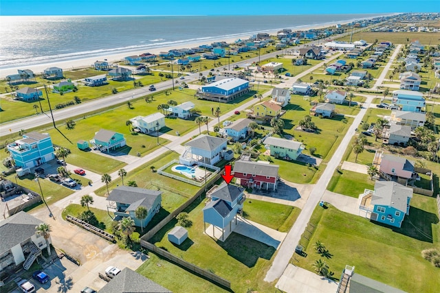 aerial view featuring a water view and a view of the beach