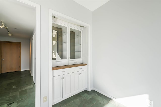 interior space featuring white cabinets