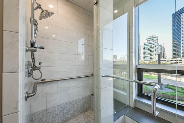 bathroom with tiled shower