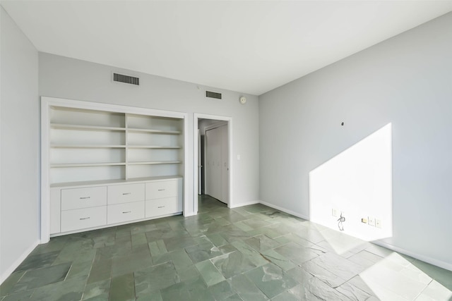 unfurnished bedroom with a closet