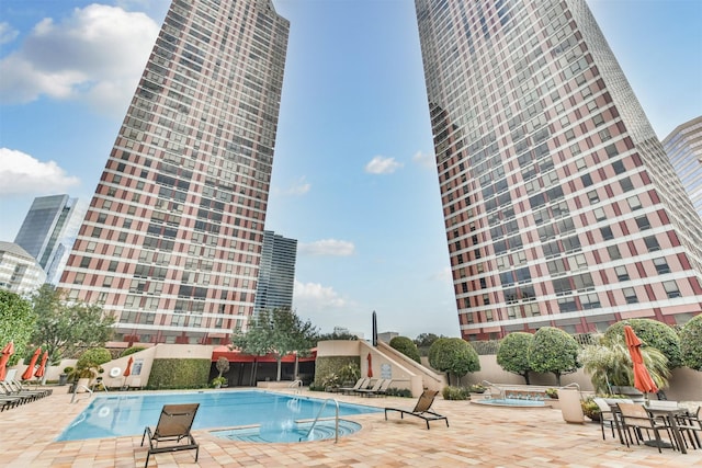 view of swimming pool with a patio area