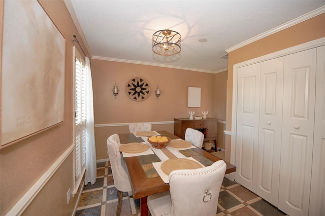 dining space featuring crown molding and a chandelier