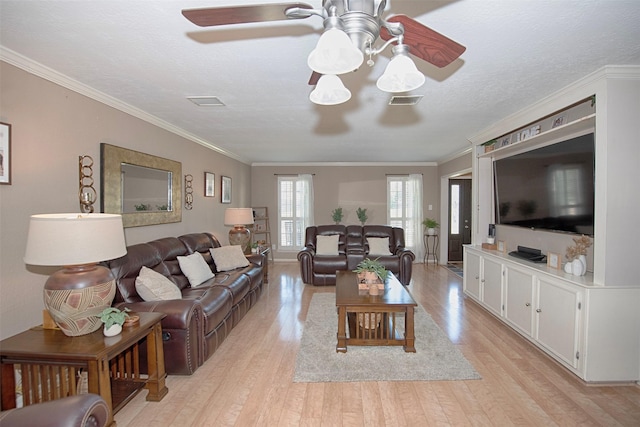 living room with crown molding, a textured ceiling, ceiling fan, and light wood-type flooring