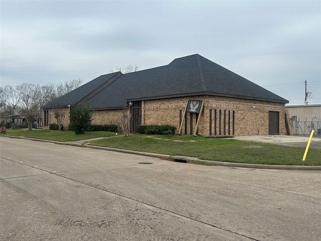 view of home's exterior with a lawn