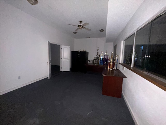 7555 Morley St, Houston, TX 77061 - home office featuring a ceiling fan and baseboards