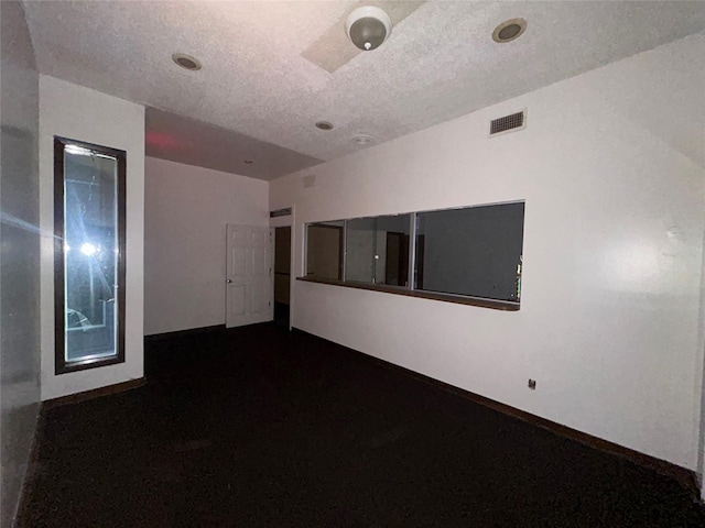 7555 Morley St, Houston, TX 77061 - spare room with baseboards, visible vents, and a textured ceiling