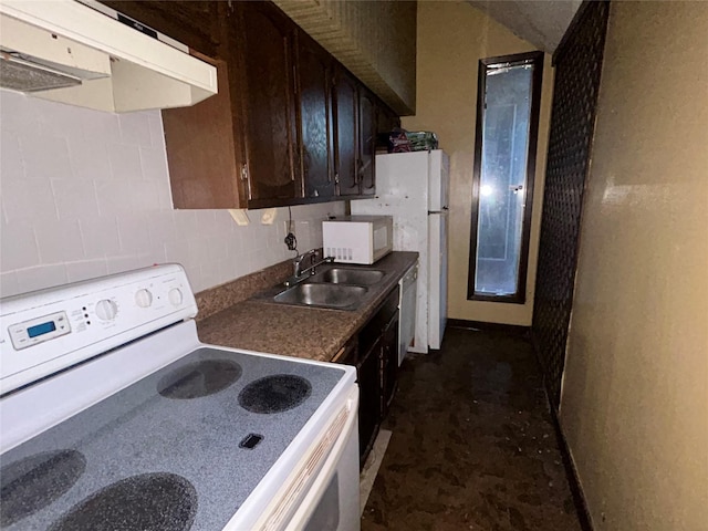 7555 Morley St, Houston, TX 77061 - kitchen featuring white appliances, under cabinet range hood, dark brown cabinets, dark countertops, and a sink