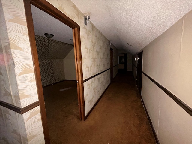 7555 Morley St, Houston, TX 77061 - corridor with a textured ceiling, wallpapered walls, and lofted ceiling