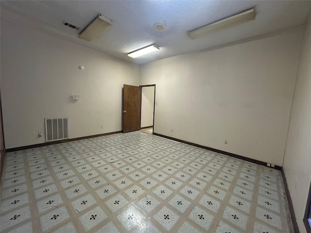 7555 Morley St, Houston, TX 77061 - spare room with a textured ceiling, visible vents, and baseboards