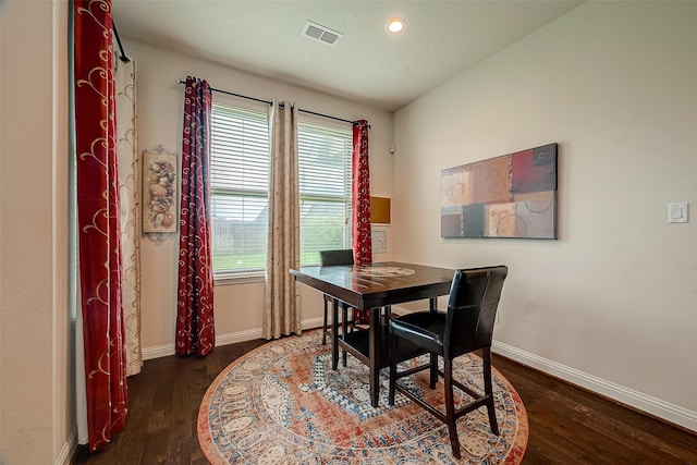 dining room with dark hardwood / wood-style flooring