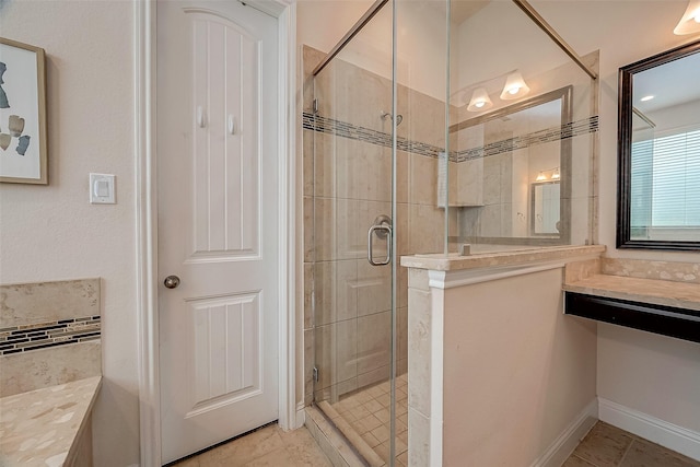 bathroom featuring tile patterned floors and an enclosed shower