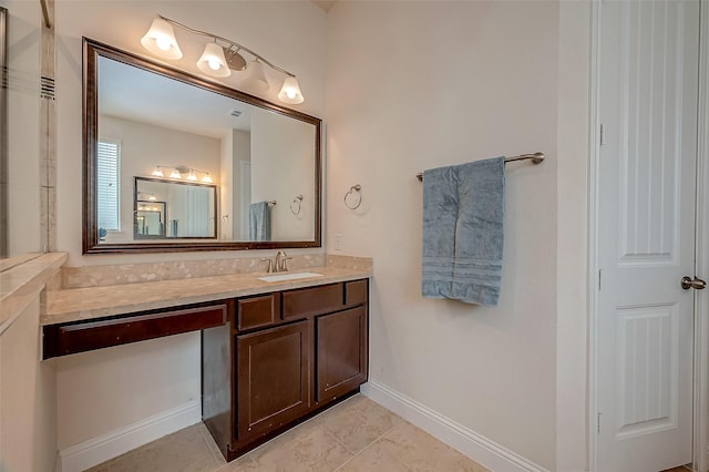 bathroom featuring tile patterned flooring and vanity