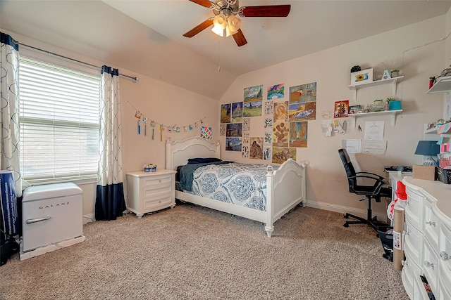 carpeted bedroom featuring vaulted ceiling and ceiling fan