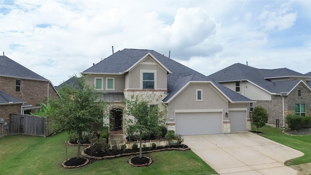 view of front of house with a garage and a front yard