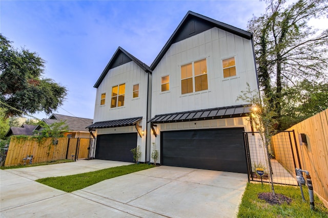 modern inspired farmhouse with a garage