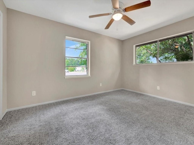 carpeted empty room with ceiling fan