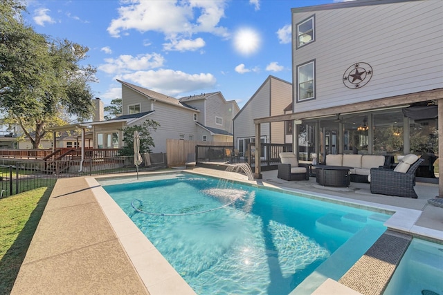 view of swimming pool with pool water feature, a patio, and an outdoor hangout area