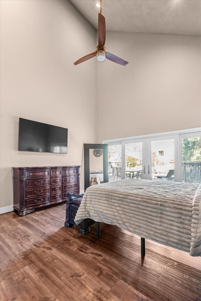 bedroom featuring access to exterior, ceiling fan, high vaulted ceiling, and wood-type flooring