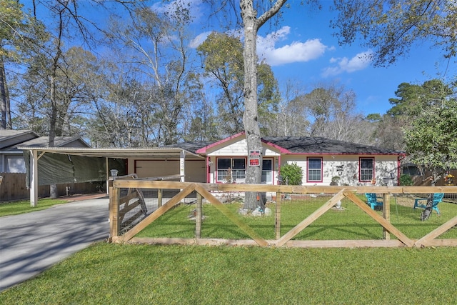 view of front facade with a front lawn and a carport