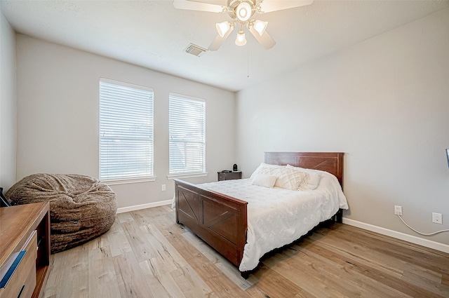 bedroom featuring light hardwood / wood-style floors and ceiling fan