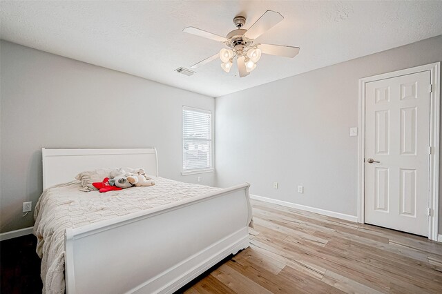 bedroom featuring ceiling fan and light wood-type flooring