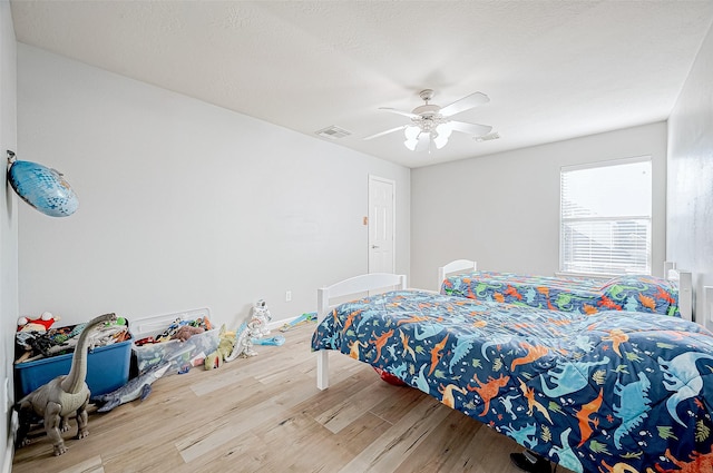 bedroom featuring ceiling fan and hardwood / wood-style floors